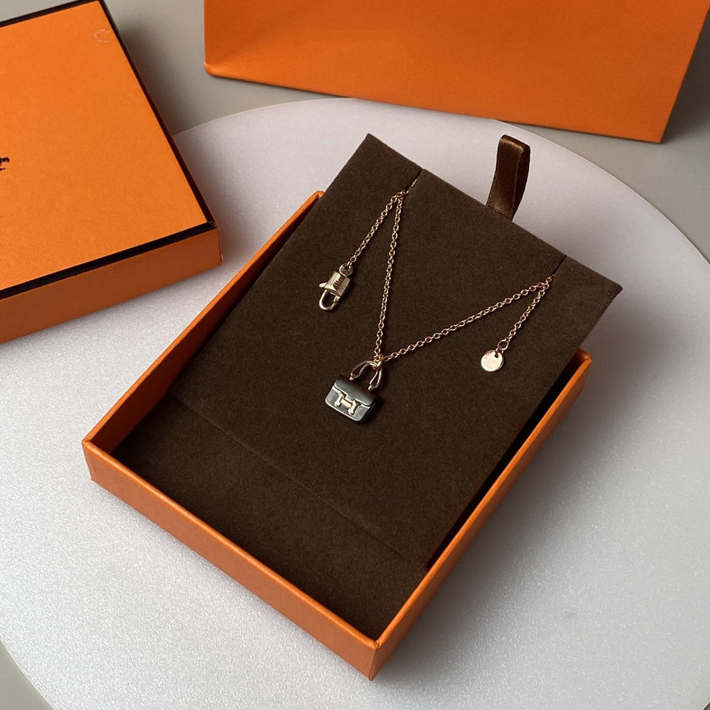 HERMES CONSTANCE BLACK PEDANT PINK GOLD NECKLACE